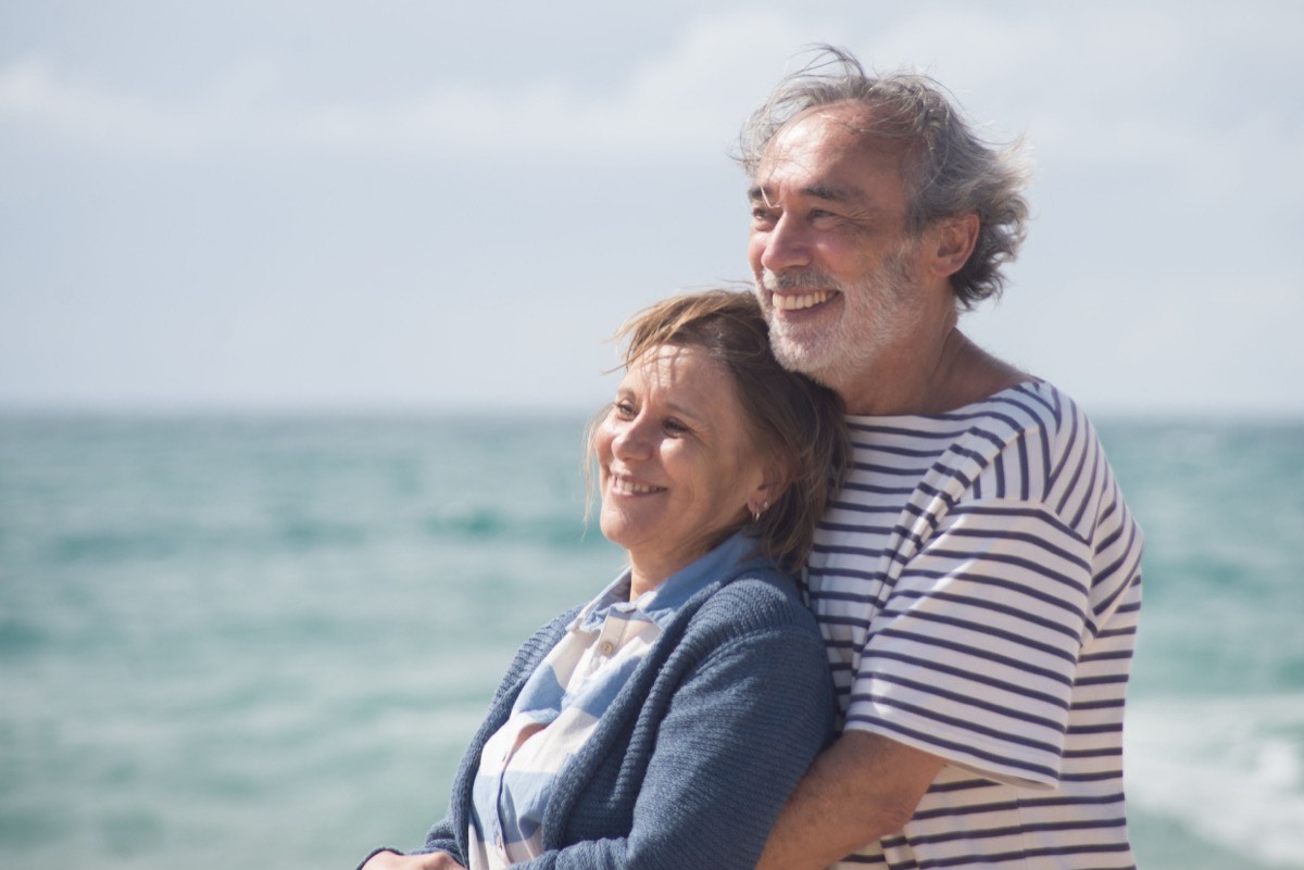 Mature couple embracing on a beach