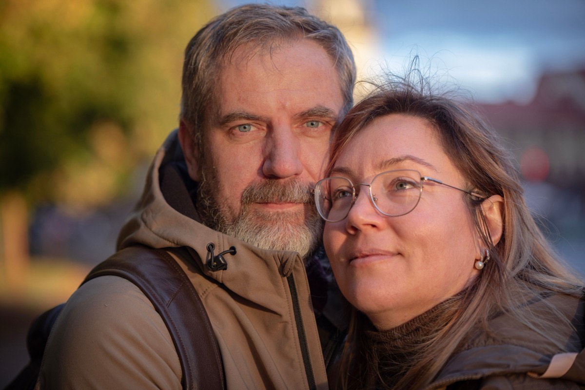 Mature couple portrait in soft golden-hour light
